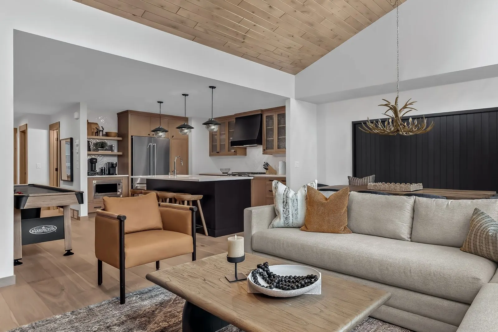 Open-plan mountain living space with vaulted ceiling